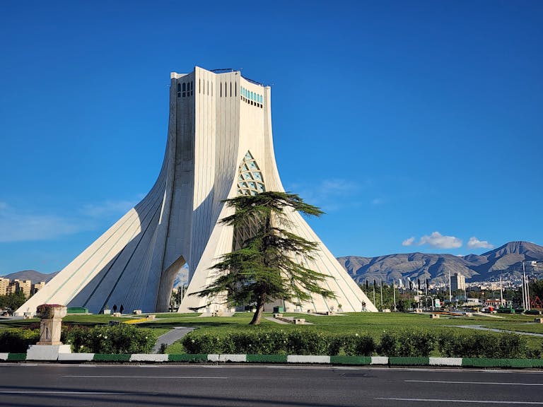 Beautiful architectural landmark Azadi Tower in Tehran with clear blue skies.